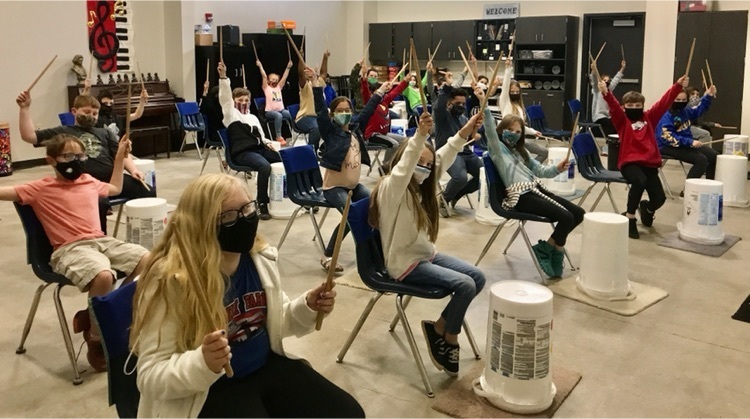 image of students with hands in the air