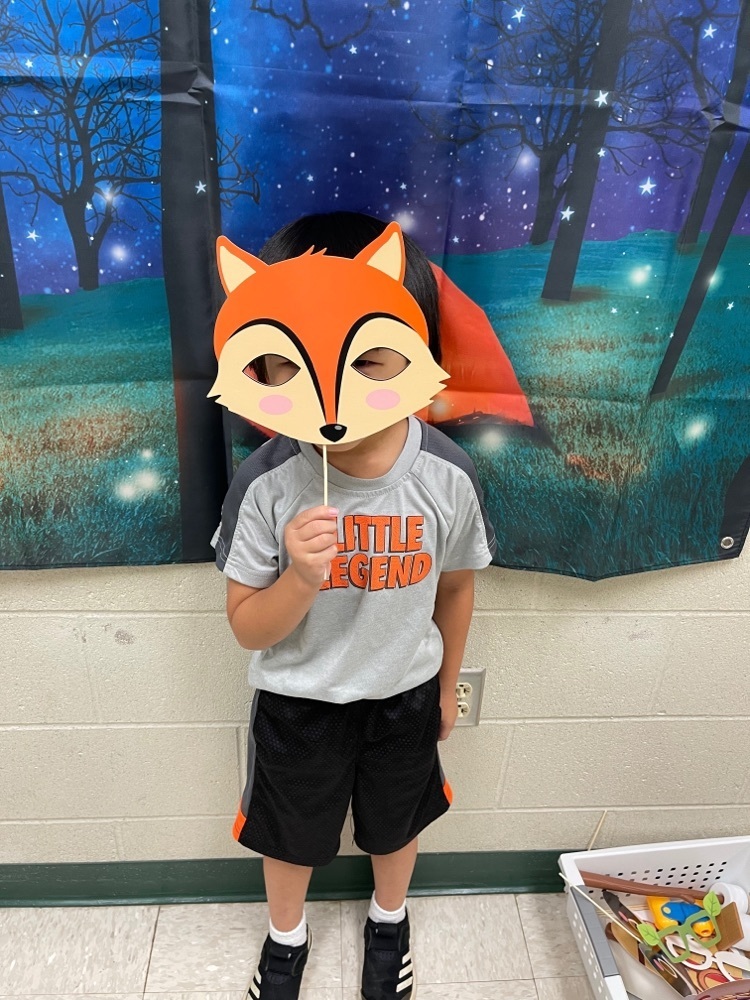 Image of students with a Fox mask.